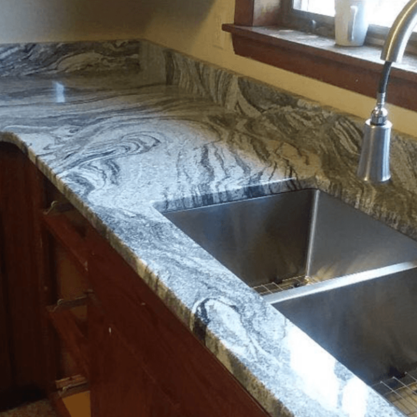 a countertop newly redone for the winner of paul white company's ugly countertop contest
